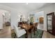 Inviting dining room with a wooden table, elegant decor, and a view of other rooms at 3878 Amicus Dr, Buford, GA 30519