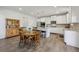 Spacious eat-in kitchen with stainless appliances and access to another room through the doorway at 3878 Amicus Dr, Buford, GA 30519