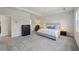 Comfortable main bedroom featuring plush carpet, a ceiling fan, and neutral tones at 3878 Amicus Dr, Buford, GA 30519