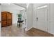 Well-lit office space with French doors, a desk, and a rustic wooden cabinet at 3878 Amicus Dr, Buford, GA 30519