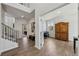 Bright and airy office with hardwood floors, piano, and ample natural light at 3878 Amicus Dr, Buford, GA 30519