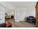 Cozy office featuring french doors, a piano, and an acoustic guitar on display at 3878 Amicus Dr, Buford, GA 30519