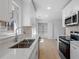 Bright updated kitchen with stainless appliances, white cabinets and countertops at 5225 Maple Valley Sw Rd, Mableton, GA 30126