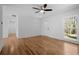 Large living room with hardwood floors, a ceiling fan, and natural light at 5225 Maple Valley Sw Rd, Mableton, GA 30126