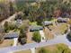 Aerial view of a home surrounded by trees and neighborhood streets at 3351 Grand Central Dr, Snellville, GA 30078