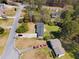 Aerial view of a house with a driveway and surrounding foliage at 3351 Grand Central Dr, Snellville, GA 30078
