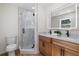 Modern bathroom with a glass shower, double vanity, and contemporary fixtures at 3351 Grand Central Dr, Snellville, GA 30078