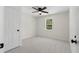 Clean bedroom with a ceiling fan and window allowing for ample natural light at 3351 Grand Central Dr, Snellville, GA 30078