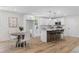 Open kitchen with white cabinets, stainless steel appliances, and an island with barstool seating at 3351 Grand Central Dr, Snellville, GA 30078