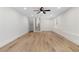 Bright living room with hardwood floors, ceiling fan, and natural light through the window at 3351 Grand Central Dr, Snellville, GA 30078