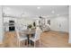 Open concept living and dining area with hardwood floors and natural light at 3351 Grand Central Dr, Snellville, GA 30078