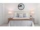 Well-lit main bedroom with stylish linens, lamps, and a ceiling fan at 3351 Grand Central Dr, Snellville, GA 30078