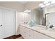 Bathroom featuring white cabinets, a granite countertop, a modern mirror, and neutral-toned walls at 4121 N Swann St, Covington, GA 30014