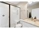 Updated bathroom features a glass enclosed shower and granite countertop at 4121 N Swann St, Covington, GA 30014