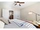 Comfortable bedroom with sitting area has a ceiling fan and plenty of natural light at 4121 N Swann St, Covington, GA 30014