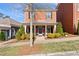 Charming two-story brick home with covered front porch and well-manicured landscaping at 4121 N Swann St, Covington, GA 30014