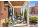 Charming front porch showcasing classic rocking chairs, brick accents, and lush greenery at 4121 N Swann St, Covington, GA 30014