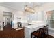 Modern kitchen featuring white cabinets, a quartz countertop, and stainless-steel appliances at 4121 N Swann St, Covington, GA 30014