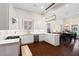 Bright kitchen with white cabinets, stainless steel dishwasher, and open floor plan at 4121 N Swann St, Covington, GA 30014