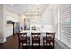 Bright kitchen featuring white cabinets, stainless steel appliances, and a breakfast bar at 4121 N Swann St, Covington, GA 30014