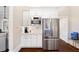 Gourmet kitchen with stainless steel appliances, a microwave, and ample countertop space at 4121 N Swann St, Covington, GA 30014