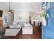 Inviting living room with hardwood floors, neutral paint, fireplace, and an open view into the modern kitchen at 4121 N Swann St, Covington, GA 30014