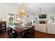 Inviting dining and living area with hardwood floors and a cozy fireplace at 4121 N Swann St, Covington, GA 30014