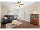 Comfortable sitting area with a reclining sofa and an antique cabinet, creating a cozy retreat at 4121 N Swann St, Covington, GA 30014