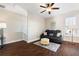 Cozy living room with a comfortable reclining sofa, patterned rug, and a floor lamp at 4121 N Swann St, Covington, GA 30014