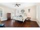 Spacious main bedroom with hardwood floors and large windows, providing ample natural light at 4121 N Swann St, Covington, GA 30014