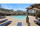 Large in-ground pool has plenty of lounge chairs and covered seating areas at 4121 N Swann St, Covington, GA 30014