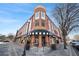 A stately retail building with a classic brick facade and awnings, offering a sophisticated shopping experience in town at 4121 N Swann St, Covington, GA 30014