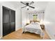 Bright bedroom with a queen bed, ceiling fan and minimalist decor at 5785 Woodruff Rd, Chattahoochee Hills, GA 30213