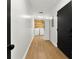 Bright laundry room features wood accent wall, washer, dryer, and storage near the entrance at 5785 Woodruff Rd, Chattahoochee Hills, GA 30213