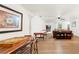 Spacious game room features hardwood floors, a brick fireplace, and ample space for entertainment at 5785 Woodruff Rd, Chattahoochee Hills, GA 30213