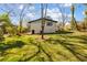 Expansive backyard with lush green grass surrounding a charming home at 1275 Calhoun Ave, Atlanta, GA 30344