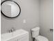 Modern half-bath with vessel sink, framed mirror, and toilet at 1275 Calhoun Ave, Atlanta, GA 30344