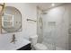 Updated bathroom with glass enclosed shower and sleek modern fixtures at 1275 Calhoun Ave, Atlanta, GA 30344