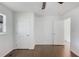 Bedroom with closet, dark wood floors, and connecting door at 1275 Calhoun Ave, Atlanta, GA 30344