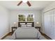 Bedroom featuring a bed, hardwood floors, double windows, and closet at 1275 Calhoun Ave, Atlanta, GA 30344