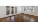Spacious bedroom with hardwood floors, large windows, and neutral paint at 1275 Calhoun Ave, Atlanta, GA 30344
