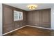 Dining room showcasing elegant wall paneling and hardwood flooring at 1275 Calhoun Ave, Atlanta, GA 30344