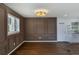Dining room features custom trim, hardwood floors, and a modern light fixture at 1275 Calhoun Ave, Atlanta, GA 30344