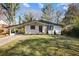 Charming home with a covered parking area and a well-maintained front yard at 1275 Calhoun Ave, Atlanta, GA 30344