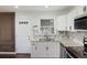 Renovated kitchen featuring granite counters, herringbone backsplash, and stainless appliances at 1275 Calhoun Ave, Atlanta, GA 30344