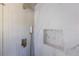 Modern shower featuring stylish tile, shower head, and convenient recessed shelving at 1275 Calhoun Ave, Atlanta, GA 30344