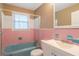 Retro bathroom with a combination shower and tub at 1334 Jennie Sw Ln, Lilburn, GA 30047