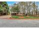 Traditional brick ranch home surrounded by mature trees and landscaping at 1334 Jennie Sw Ln, Lilburn, GA 30047