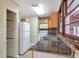 Functional kitchen with a double sink and white appliances, and plenty of storage at 1334 Jennie Sw Ln, Lilburn, GA 30047