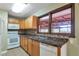 Efficient kitchen with white appliances, mosaic backsplash, and natural lighting at 1334 Jennie Sw Ln, Lilburn, GA 30047